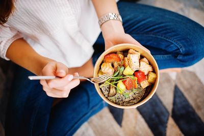 Midsection of man holding food