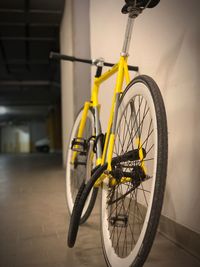 Close-up of yellow bicycle on street