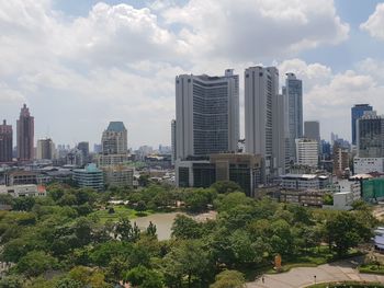 Modern buildings in city against sky