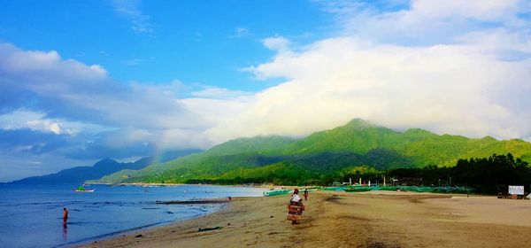 Scenic view of sea against cloudy sky