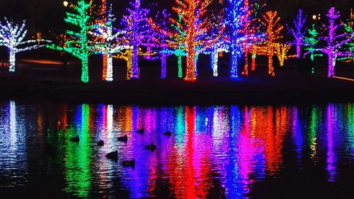 Reflection of illuminated lights in water at night