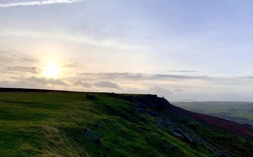 Scenic view of landscape against sky during sunset