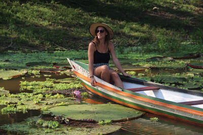Portrait of young woman in boat