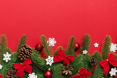 Close-up of christmas decorations against yellow background