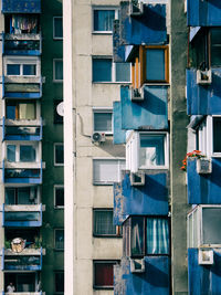 Crowded old balconies in run-down project housing with one man in sarajevo 