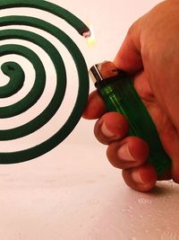 Close-up of hand holding paper