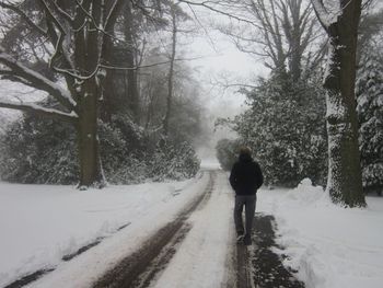 People walking on snow covered road