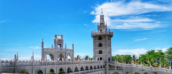 Low angle view of historical building against blue sky