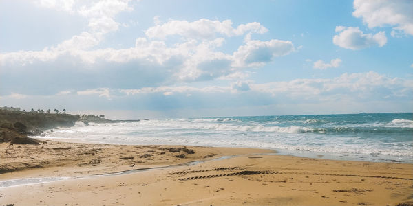 Scenic view of beach against sky