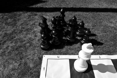 High angle view of chess pieces on floor