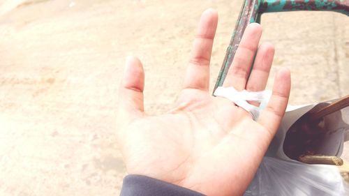 Close-up of man holding paper