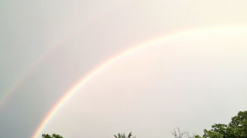 Low angle view of rainbow against clear sky