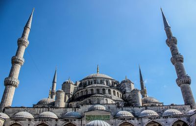 Low angle view of building against blue sky