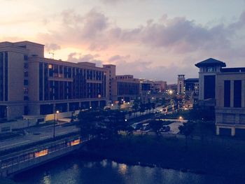 Buildings in city at sunset