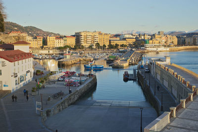 High angle view of river amidst buildings in city