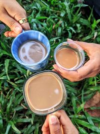 Cropped hand of woman holding coffee