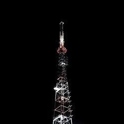 Low angle view of tower at night