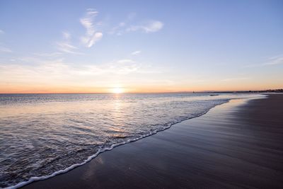 Scenic view of sea against sky at sunset