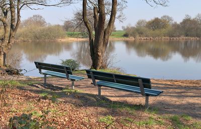 Empty bench at lakeshore