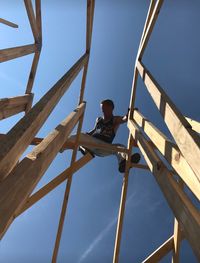 Low angle view of man against sky