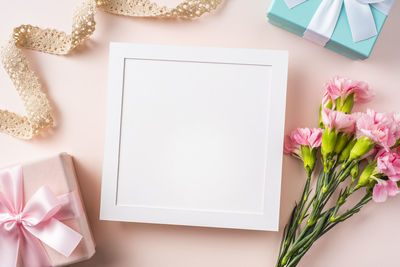 High angle view of pink flower on table