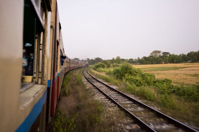 Railroad tracks against clear sky