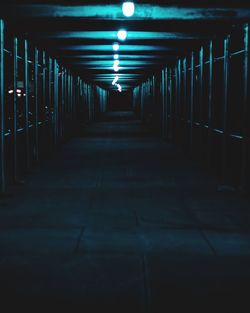 Empty corridor in building at night