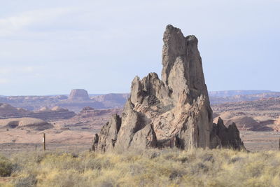 Rock formations on landscape against sky