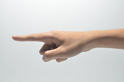 Close-up of woman hand over white background