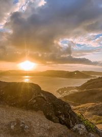 Scenic view of sunset over land