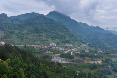 High angle view of trees and mountains against sky