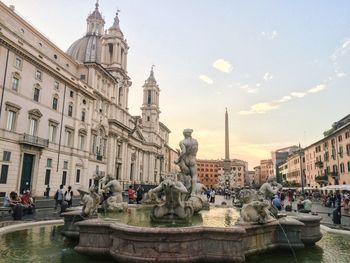 Fountain and people at piazza navona in city