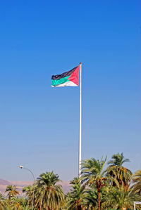 The giant flag of jordan flying above the port of aqaba