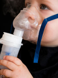 Close-up of hand holding ice cream