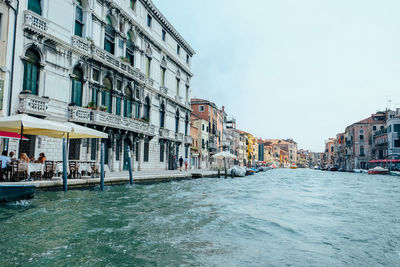 Canal passing through city buildings