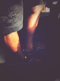 Low section of man standing on floor