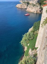 High angle view of sailboats on sea