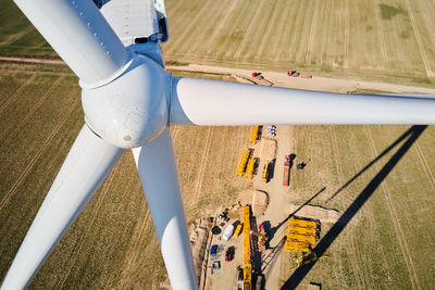 Construction site near windmill turbine, wind generator installing