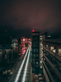 High angle view of illuminated street against sky