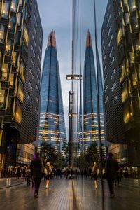 Panoramic view of skyscrapers in city at night