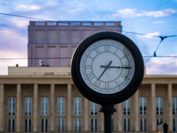 Street clock show morning hours during people going to the work and school