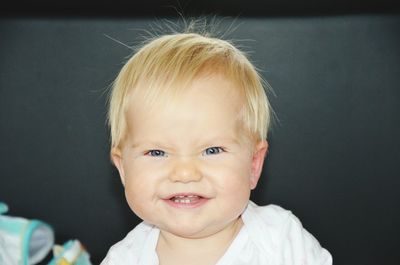 Close-up portrait of smiling boy
