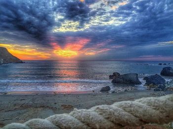 Scenic view of sea against cloudy sky