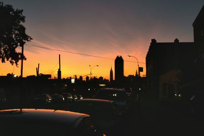 View of city street at sunset