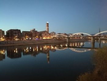 Reflection of illuminated buildings in water