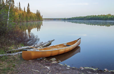 Boat moored in lake