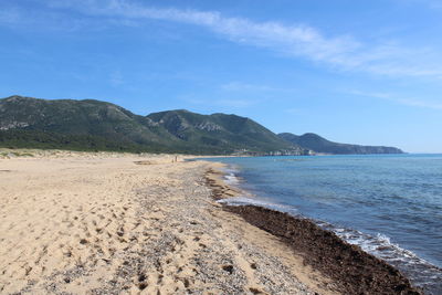 Scenic view of sea against blue sky