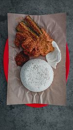 Rice, potato chicken, eggplant, and chili paste on the plate.