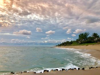 Scenic view of beach against sky