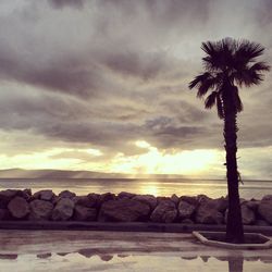 Scenic view of sea against cloudy sky